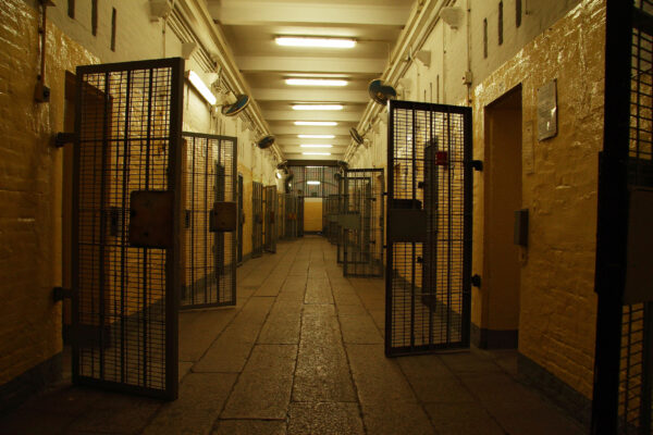 Rape & Sexual Assault Defense 6 Open doors in a prison hallway