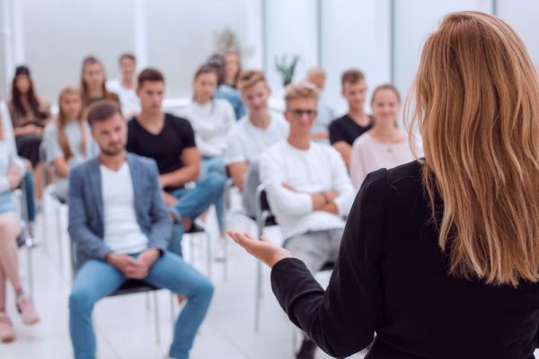 DUI Classes in Vista 1 A woman speaking in front of a group of seated individuals that could be participating at a DUI class in California or a MADD VIP program.